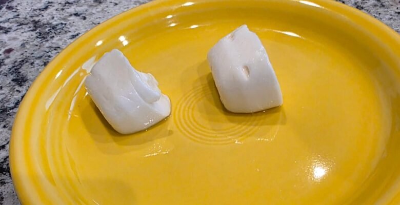 two cubes of garlic butter on a plate