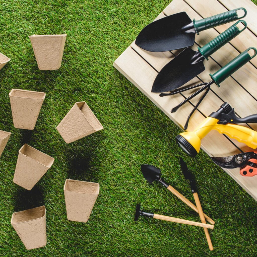 picture of various garden tools and supplies including the four best garden hand tools